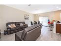 Open-concept living and dining area with light wood flooring and neutral paint at 10733 Savannah Landing Cir, Orlando, FL 32832