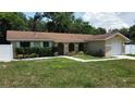 Charming one story home with a one-car attached garage and arched entryway at 114 N Alderwood St, Winter Springs, FL 32708