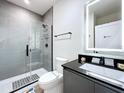 Sleek bathroom with a glass-enclosed shower, modern vanity, and contemporary fixtures at 1425 Serendipity Ln, Clermont, FL 34714