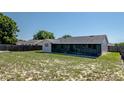 Spacious backyard featuring a screen enclosed lanai area perfect for outdoor entertaining and relaxation at 408 Sandpiper Ridge Dr, Orlando, FL 32835
