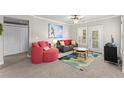 Comfortable living room area with modern sofa and colorful accents at 438 Water St # 438, Celebration, FL 34747