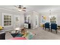 Open living area with dining set, bright windows and neutral walls at 438 Water St # 438, Celebration, FL 34747