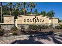 Landscaped community sign for Solivita with stone accents and vibrant plantings at 803 Shady Canyon Way, Kissimmee, FL 34759