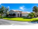 Charming single-story home with a well-manicured lawn and beautiful landscaping at 803 Shady Canyon Way, Kissimmee, FL 34759