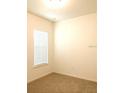 Bedroom with a window and neutral carpeting at 8607 Crescendo Ave, Windermere, FL 34786