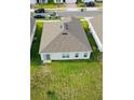 Aerial view of a well maintained backyard and roof at 1190 Lexington Lane, Haines City, FL 33844