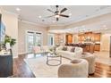 Bright living room features hardwood floors, modern furnishings, and an open floor plan at 12649 Dallington Ter, Winter Garden, FL 34787
