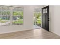 Bright living room showcasing new floors, fresh paint, and lots of natural light at 1842 Puritan Ave, Winter Park, FL 32792
