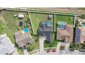 Aerial view of homes, showcasing backyard pools, green lawns, and neighborhood layout at 2410 Sweetwater Blvd, St Cloud, FL 34772