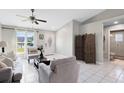 Inviting living area with a decorative front door and an open view to the bathroom at 2454 Quail Run N Blvd, Kissimmee, FL 34744
