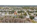 Aerial view of a neighborhood with many trees at 2507 Talega Dr, St Cloud, FL 34772