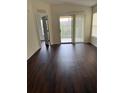 Bedroom with lots of natural light and a sliding glass door to the balcony at 2828 Club Cortile Cir # B, Kissimmee, FL 34746