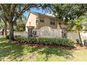Landscaped entrance to Club Cortile, offering a welcoming community vibe at 2828 Club Cortile Cir # B, Kissimmee, FL 34746
