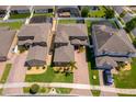 Aerial shot showcases the home's layout, brick driveway, landscaping, and proximity to neighboring houses at 3159 Somerset Park Dr, Orlando, FL 32824