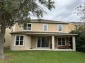 The home has a spacious backyard with a covered patio area perfect for outdoor entertaining at 6957 Northwich Dr, Windermere, FL 34786