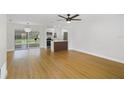 Spacious open-concept design featuring hardwood floors and a combined living room and kitchen at 818 Ballard St, Altamonte Springs, FL 32701