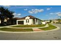 Well-maintained corner lot with landscaped lawn, sidewalk, and a charming single-story home, creating inviting curb appeal at 1025 Belvoir Dr, Kissimmee, FL 34744