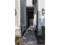 Inviting front door with stone accents and pathway leading to a beautifully landscaped entrance at 11378 Whistling Pine Way, Orlando, FL 32832