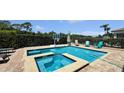 Backyard swimming pool and spa area with plenty of deck space for lounging and enjoying the Florida sun at 1228 Castle Pines Ct, Reunion, FL 34747