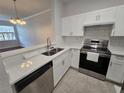 Well-equipped kitchen featuring stainless steel appliances and quartz countertops at 2572 Robert Trent Jones Dr # 1227, Orlando, FL 32835