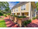 Community pool area with lounge chairs surrounded by lush landscaping at 4017 Dijon Dr # 4017K, Orlando, FL 32808