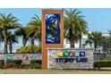 Beautiful sign for Storey Lake community with palm tree design and stone base at 4875 Clock Tower Dr, Kissimmee, FL 34746