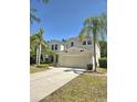 Charming two-story home with a well manicured lawn and beautiful landscaping at 5704 Ansley Way, Mount Dora, FL 32757