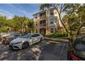 Three story condo building with parking available in front at 6214 Stevenson Dr # 106, Orlando, FL 32835