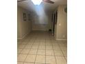 Well-lit dining room featuring neutral walls, a ceiling fan, and tile flooring at 2005 Kingsland Ave, Orlando, FL 32808