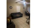 Inviting living room with neutral paint, a ceiling fan, and tile floors at 2005 Kingsland Ave, Orlando, FL 32808