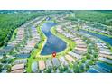 Aerial view of homes and surrounding community including a large lake at 233 Rialto Rd, Kissimmee, FL 34759