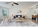 Comfortable living room with stylish furniture, a ceiling fan, and bright natural light at 2743 N Poinciana Blvd # 55, Kissimmee, FL 34746