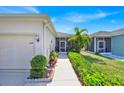 Charming walkway leading to the screened-in porch entrance of a well-maintained single-story home at 3193 Whispering Trails Ave, Winter Haven, FL 33884
