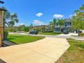 A quiet neighborhood street with manicured lawns and well-maintained homes at 4720 Doral Pointe Dr, Kissimmee, FL 34758
