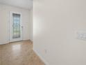 Bright foyer featuring decorative front door with tiled floor at 5473 Animosh Ct, Polk City, FL 33868