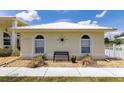 Charming home with decorative accents and a cozy front bench, creating a welcoming curb appeal at 6555 Bay Tree Ct, St Cloud, FL 34771