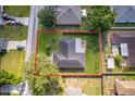 An aerial view of the property with lush green space and privacy at 812 Adour Dr, Kissimmee, FL 34759