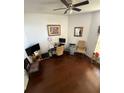 Bright office space with wood floors, a ceiling fan, and furniture at 939 Jaybee Ave, Davenport, FL 33897