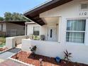 Welcoming single-story home boasting a cozy front patio and well-kept landscaping at 1101 28Th Nw St, Winter Haven, FL 33881
