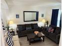 Inviting living room with modern decor, comfortable seating, and stylish nautical accents at 2514 Dharma Cir, Kissimmee, FL 34746