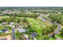 Expansive aerial view of a golf course community with well-manicured lawns and lush green surroundings at 30 Lake Diamond Ave, Ocala, FL 34472