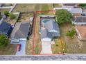 Aerial view of a home with a screened-in pool and a well-maintained lawn at 3647 Minute Maid Ramp Rd 1 Rd, Davenport, FL 33837