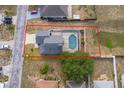 Aerial view of backyard featuring a private screened-in pool and mature landscaping at 3647 Minute Maid Ramp Rd 1 Rd, Davenport, FL 33837