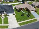 An aerial view of a single-story home with a well-maintained lawn and neighborhood setting at 3811 Gator Bay Ln, St Cloud, FL 34772