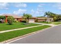 Beautiful single Gathering home boasts manicured lawn and inviting curb appeal in a suburban setting at 3811 Gator Bay Ln, St Cloud, FL 34772