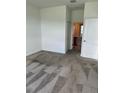 Bright bedroom featuring neutral carpet, ensuite bathroom and closet at 4053 Redbridge Loop, Davenport, FL 33837
