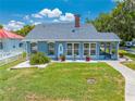 Charming house with a well-kept lawn, showcasing its neat landscaping and appealing architectural design at 435 Pennsylvania Ave, St Cloud, FL 34769