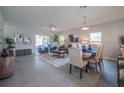 An open-concept living room featuring contemporary furnishings and lots of natural light at 130 Mediterranean Ct, Kissimmee, FL 34758