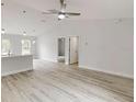 Spacious living room featuring a ceiling fan and open layout to the other areas at 14512 Sw 25Th Lane, Ocala, FL 34481