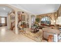 Inviting living room featuring comfortable seating, staircase, and archway at 15037 Cedar Branch Way, Orlando, FL 32824